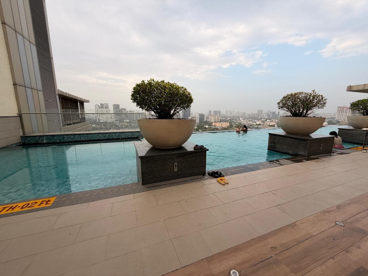 Rooftop infinity pool over the Gurgaon skyline at M3M Urbana